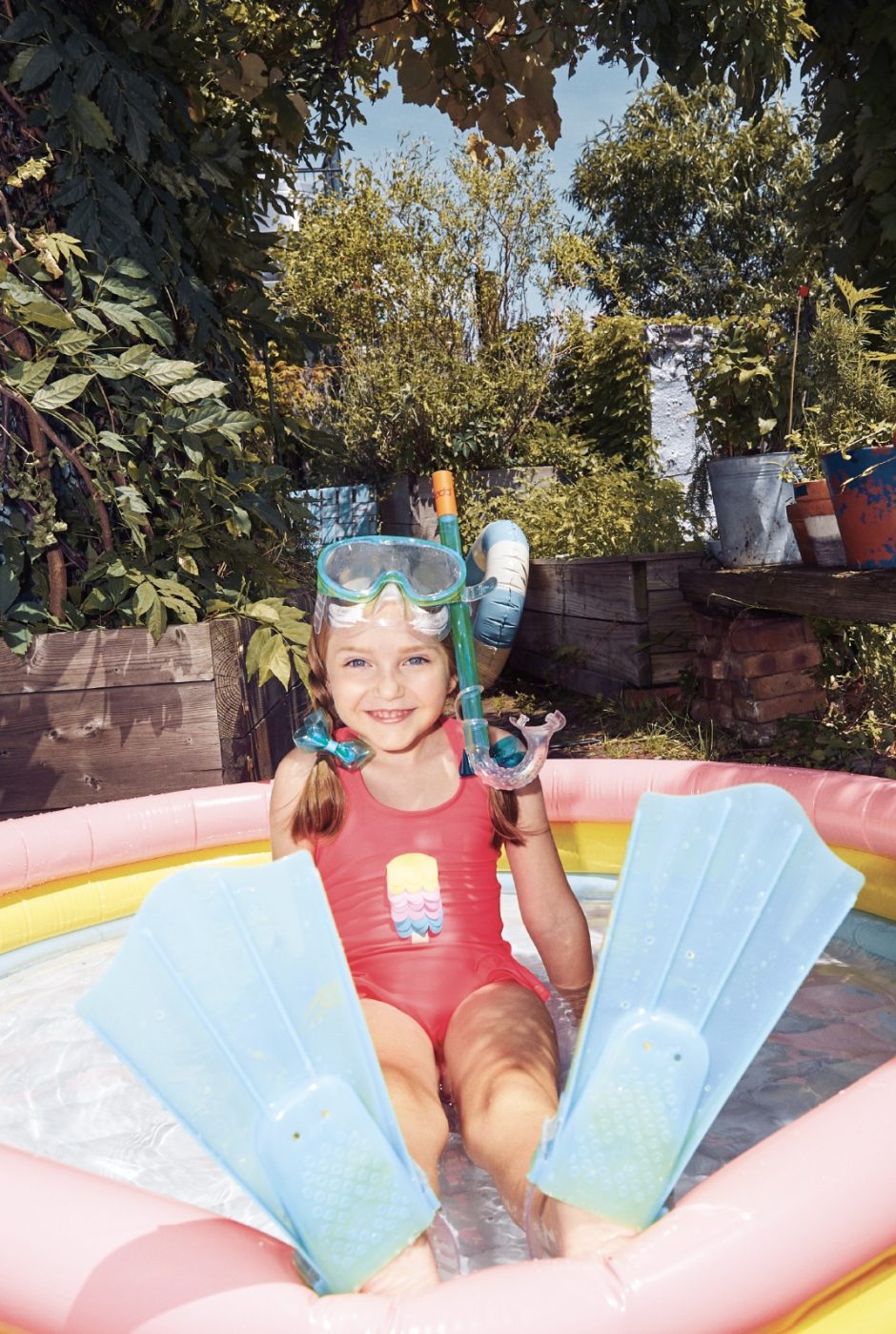 Polina’s popsicle swimsuit is from Color Kids.